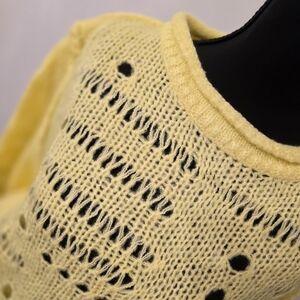 Yellow Ribbed Sweatshirt with Intricate Knit Pattern